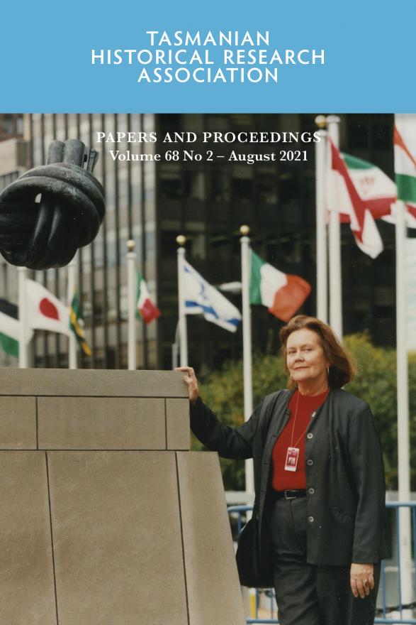 Woman standing in front of flags