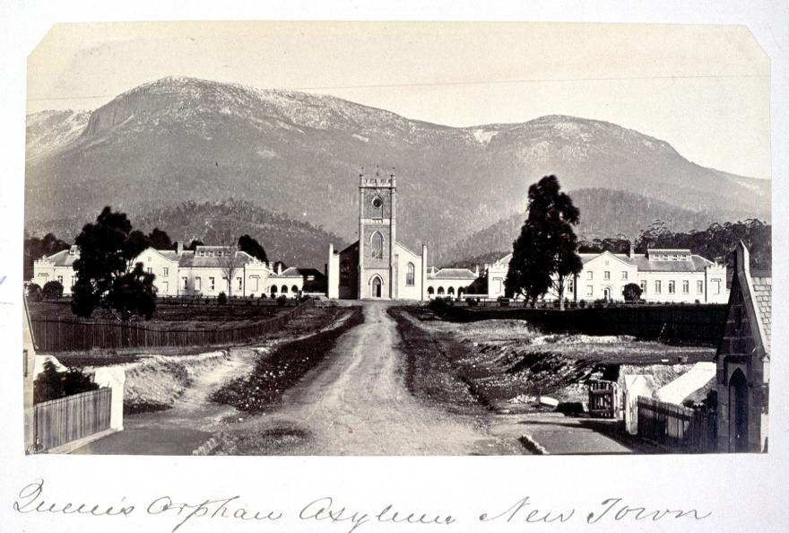 Colonial buildings in front of mountain